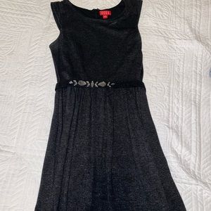 Black dress with black emblem on belt